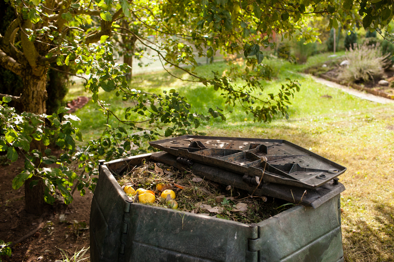 Homeowner sorting household rubbish and construction debris into separate labelled containers outside house